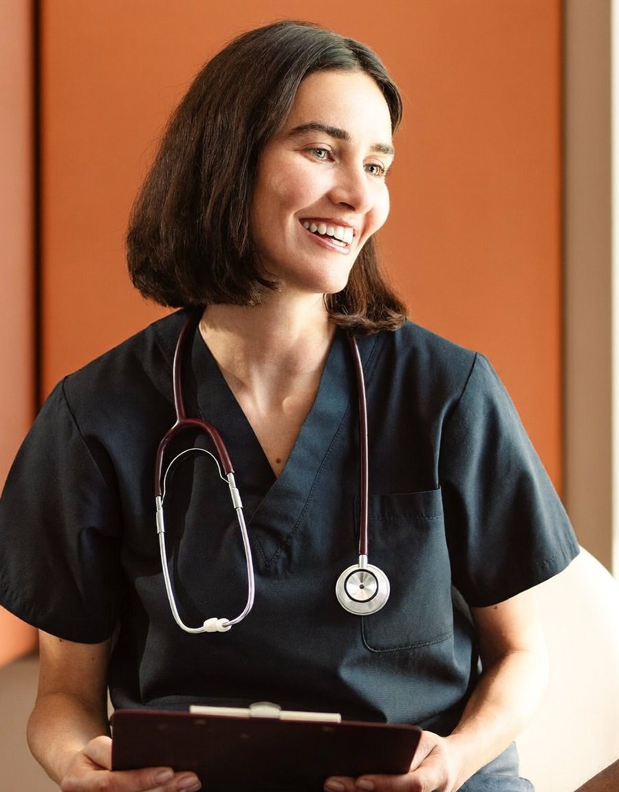 Nurse practitioner in navy scrubs